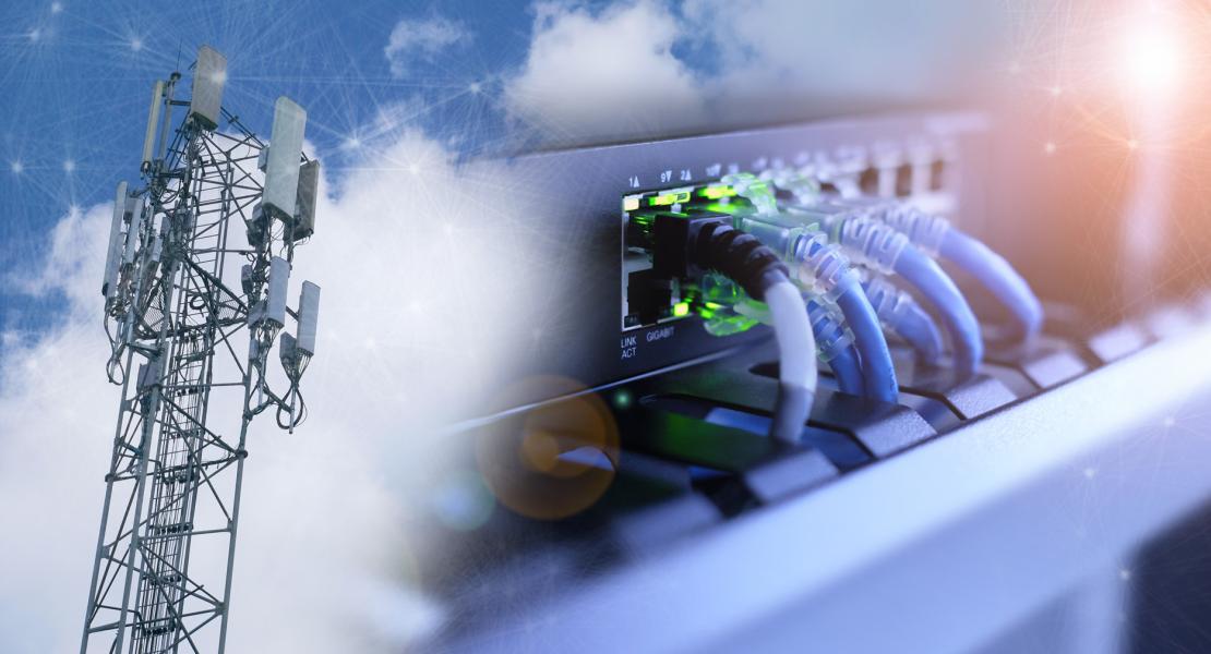 Broadband tower beside network cable panel