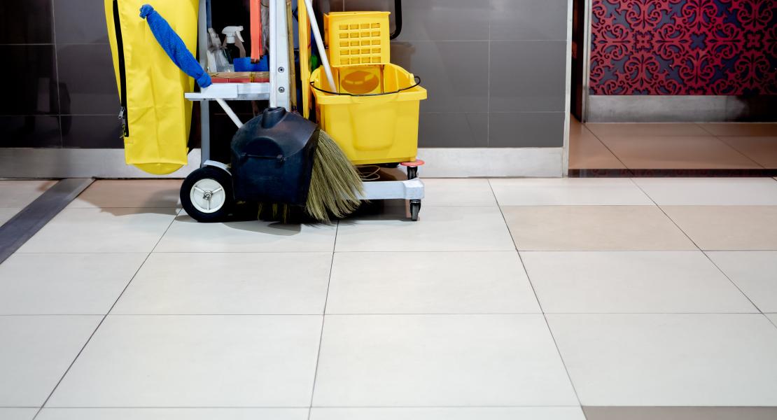 Custodian Cleaning Cart in Hallway