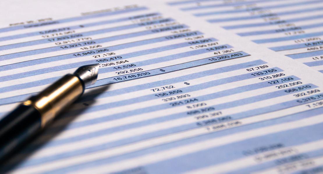 journal binder open on desk with pen