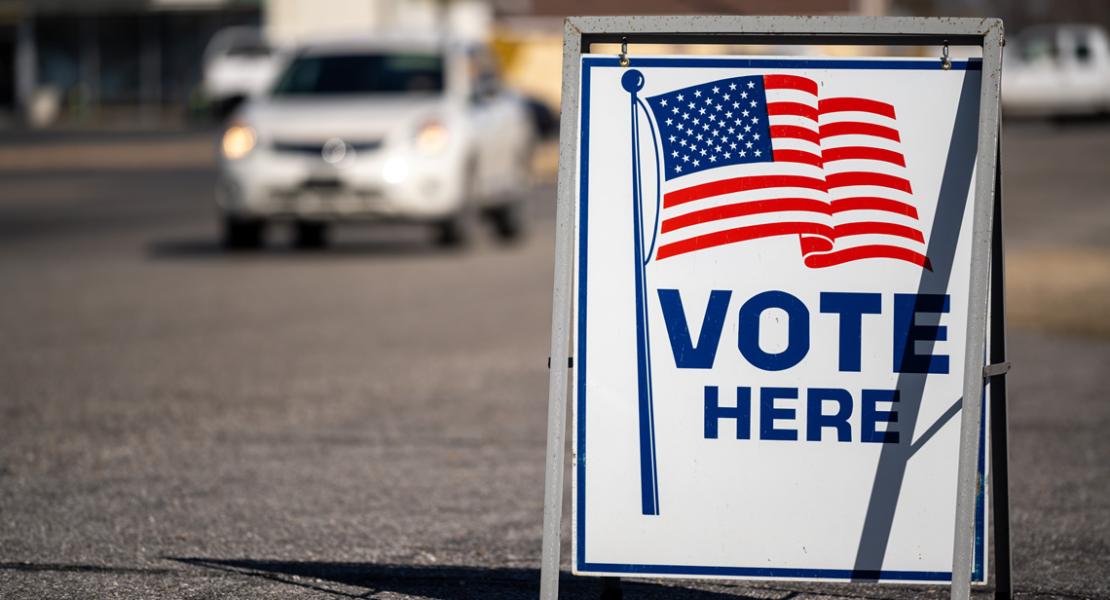 Vote Here sign in front of registration office